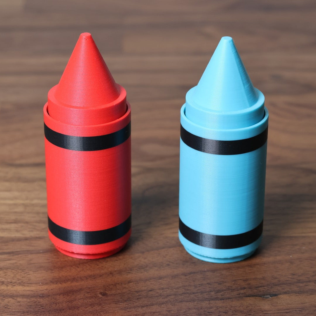 A red and sky blue 3d printed crayon shaped fidget clicker