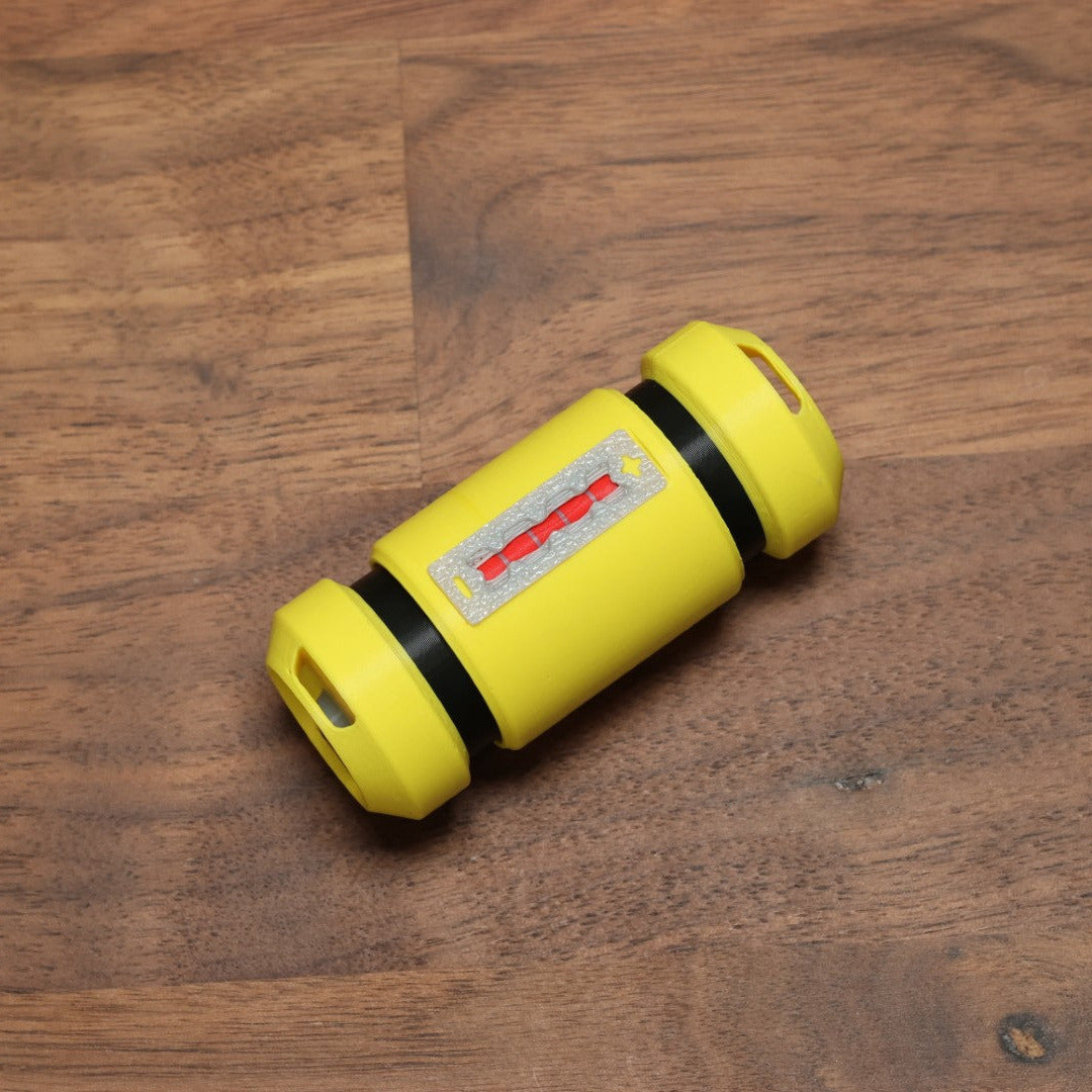 A fidget clicker in the shape of the scream canister from the movie Monsters Inc