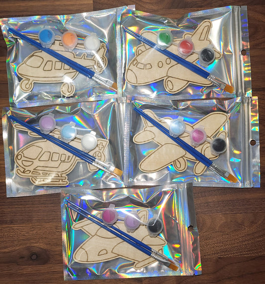 Airplane and Helicopter themed wooden engraved paint kits in a holographic bag with paint brushes