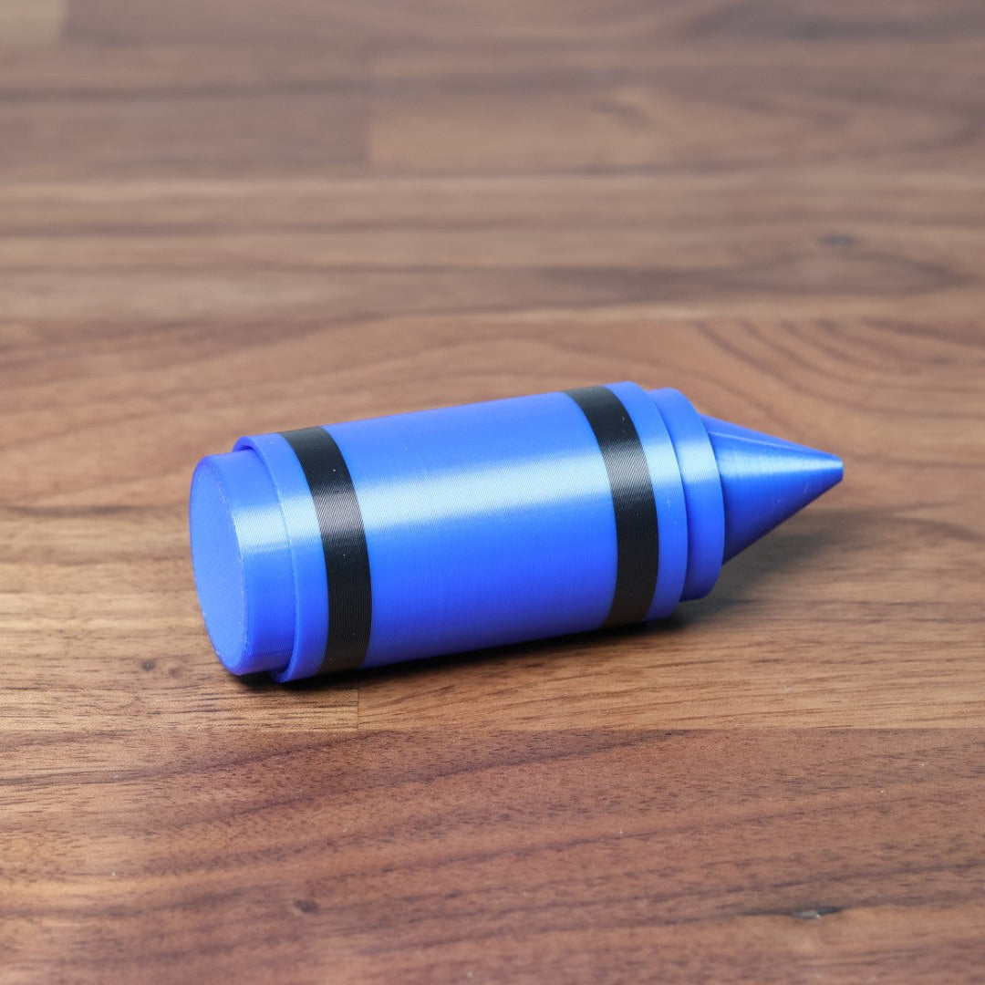 Blue coloured Crayon Dual Fidget Clicker on it's side