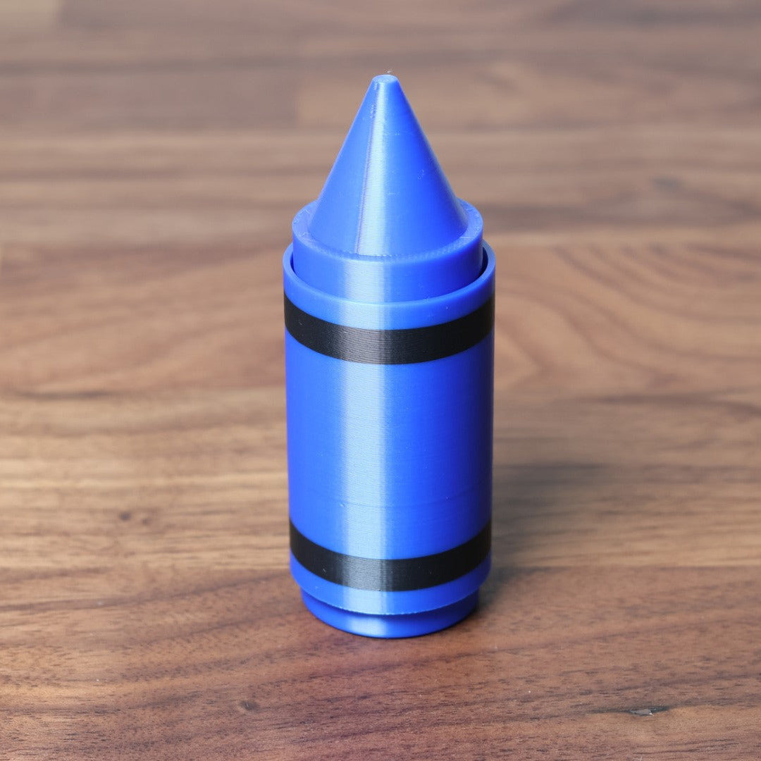 A blue 3D printed crayon shaped fidget clicker