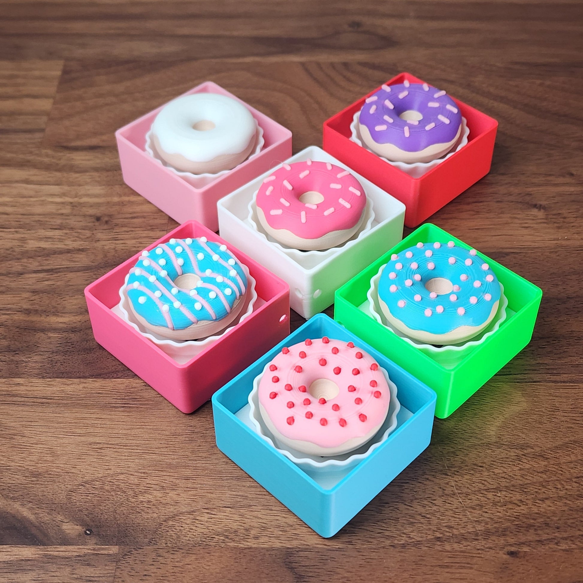 An assortment of single box donut fidget clickers