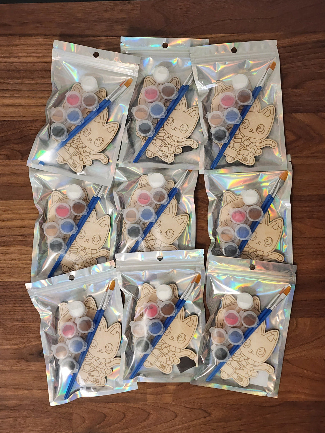 Gabby's Dollhouse themed wooden engraved paint kits in a holographic bag with paint brushes