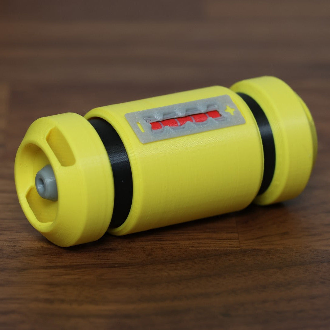 A fidget clicker in the shape of the scream canister from the movie Monsters Inc